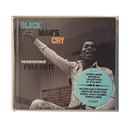 Album cover for 'Black Man's Cry: The Inspiration of Fela Kuti' featuring a sepia-toned photograph of Fela Kuti with one arm raised, wearing a light patterned jacket and matching pants. The title text is displayed in teal, brown, and orange at the top left.