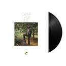 Vinyl record with cover featuring a man sitting outdoors and album title 'Grant Green Alive!'.
