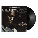 Vinyl record and cover of 'Kind of Blue' by Miles Davis with Columbia label.