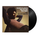 Vinyl record with a cover featuring a person and text 'The Revolution Will Not Be Televised' by Gil Scott-Heron.