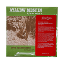 Album cover for Ayalew Mesfin's 'Good Adergechegn', featuring a green background with white text, a sepia-toned photograph of a man sitting outdoors, and white line drawings of traditional Ethiopian instruments.