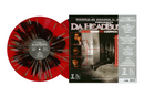 Vinyl record with red and black design and a cover featuring images of people and text.