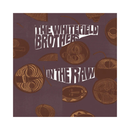 Album cover art for 'In The Raw' by The Whitefield Brothers, featuring stylized brown illustrations of coiled yarn balls and skeins on a dark plum-purple background with white text.